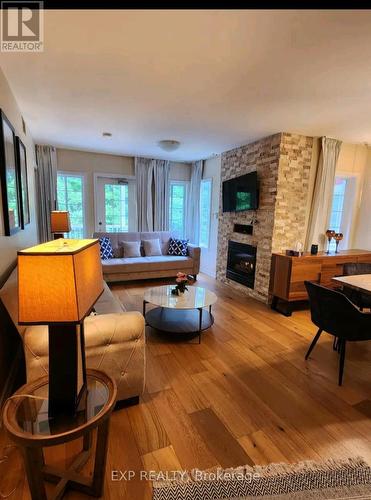 2264 - 90 Highland Drive, Oro-Medonte (Shanty Bay), ON - Indoor Photo Showing Living Room With Fireplace