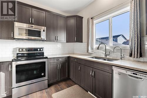 419 Secord Way, Saskatoon, SK - Indoor Photo Showing Kitchen With Double Sink