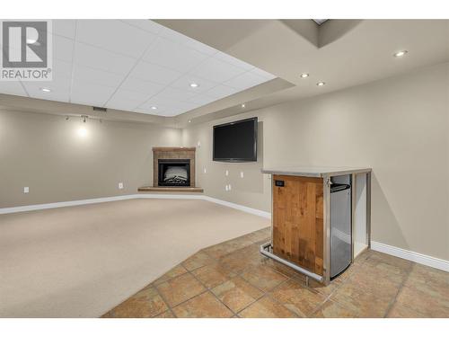 360 Rio Drive S, Kelowna, BC - Indoor Photo Showing Other Room With Fireplace