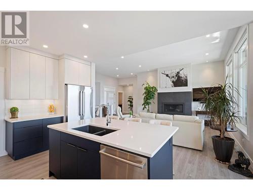 3639 Riviera Drive, Kelowna, BC - Indoor Photo Showing Kitchen With Fireplace With Double Sink With Upgraded Kitchen