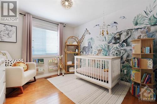 This secondary bedroom is great as a nursery, for grandchildren sleep overs or as an artists' studio! - 116 Mclachlin Street S, Arnprior, ON - Indoor Photo Showing Bedroom