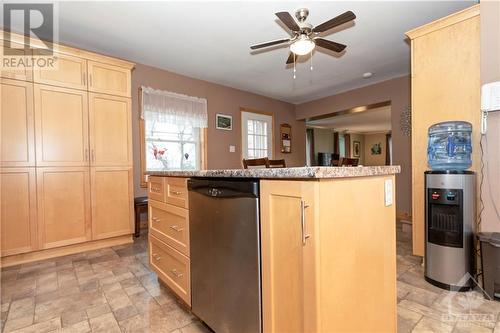 View of the island and huge wall of pantry with pull out sliders!  Look at the pot and pan drawers on the island too! - 1560 South Mcnaughton Road, Admaston, ON - Indoor Photo Showing Kitchen