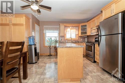 Note the other huge pantry, window over the sink, stainless steel appliances and lovely accent glass cupboard - 1560 South Mcnaughton Road, Admaston, ON - Indoor Photo Showing Kitchen