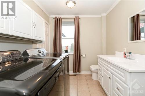 Main floor bathroom also holds the laundry room - 1560 South Mcnaughton Road, Admaston, ON - Indoor Photo Showing Other Room