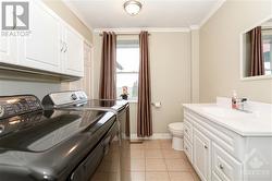 Main floor bathroom also holds the laundry room - 