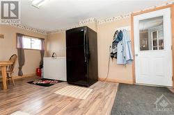 Showing the mud room with access to the absolutely HUGE attached garage.  Fridge and chest freezer can stay - 