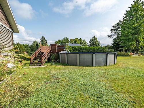 Backyard - 131 Rue Des Mésanges, Val-Des-Sources, QC - Outdoor With Above Ground Pool