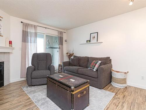 304-3008 Washington Ave, Victoria, BC - Indoor Photo Showing Living Room With Fireplace