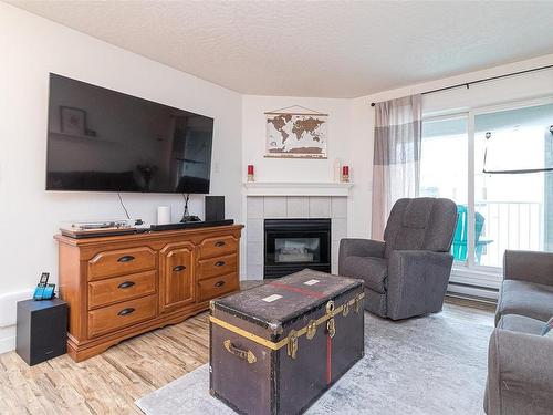 304-3008 Washington Ave, Victoria, BC - Indoor Photo Showing Living Room With Fireplace