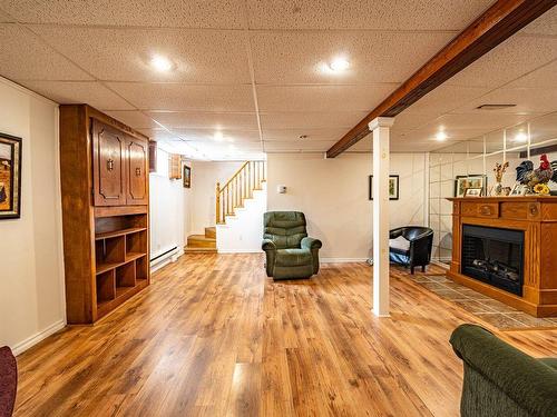 Salle familiale - 34 Rue Trottier, Victoriaville, QC - Indoor Photo Showing Other Room With Fireplace