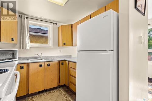 710 Rae Street, Regina, SK - Indoor Photo Showing Kitchen With Double Sink