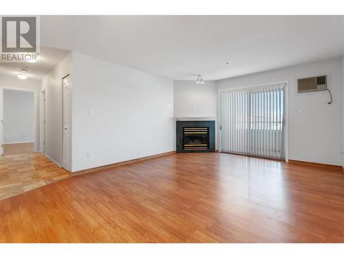 2401 South Main Street Unit# 202, Penticton, BC - Indoor Photo Showing Living Room With Fireplace