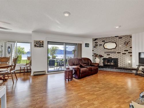 104-4340A Beach Avenue, Peachland, BC - Indoor Photo Showing Living Room With Fireplace