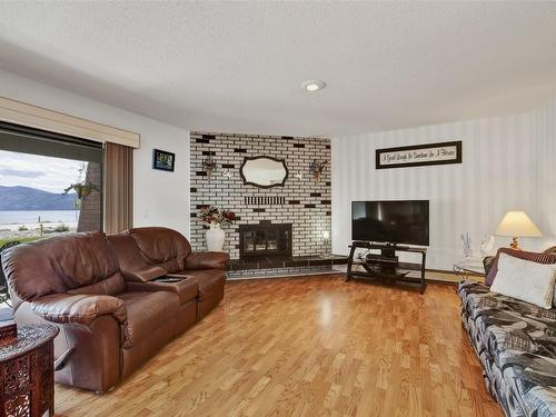 104-4340A Beach Avenue, Peachland, BC - Indoor Photo Showing Living Room With Fireplace