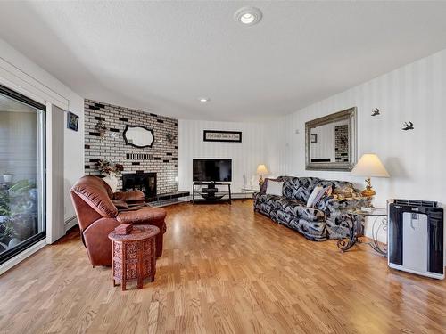 104-4340A Beach Avenue, Peachland, BC - Indoor Photo Showing Living Room With Fireplace