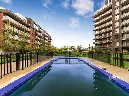 Pool - 511-8 Av. Donegani, Pointe-Claire, QC - Outdoor With In Ground Pool With Balcony