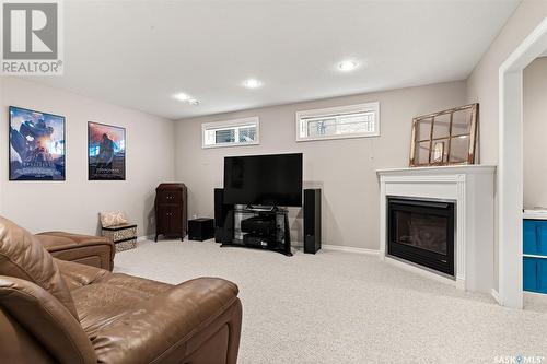 3336 Windsor Park Crescent, Regina, SK - Indoor Photo Showing Basement With Fireplace