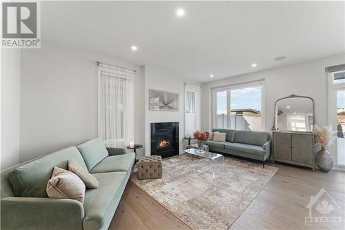 294 Squadron Crescent, Ottawa, ON - Indoor Photo Showing Living Room With Fireplace