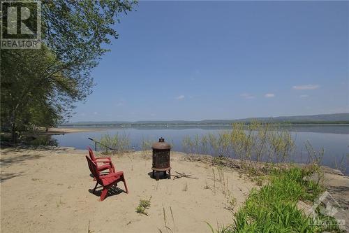 Enjoy your summer nights on your own beach property. - 620 Bayview Drive, Ottawa, ON - Outdoor With Body Of Water With View