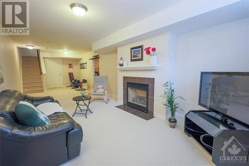 6077 North Bluff Drive, Ottawa, ON - Indoor Photo Showing Living Room With Fireplace