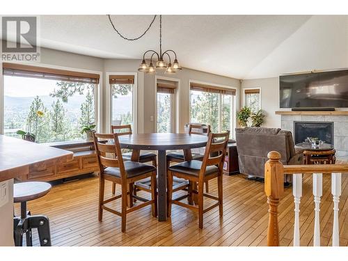 689 Cassiar Crescent, Kelowna, BC - Indoor Photo Showing Dining Room With Fireplace
