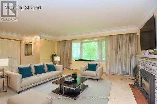 3023 St Clair Avenue, Burlington, ON - Indoor Photo Showing Living Room With Fireplace