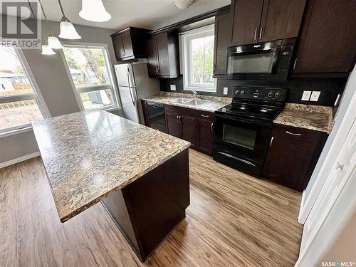 22 & 24 8Th Street Ne, Weyburn, SK - Indoor Photo Showing Kitchen With Double Sink