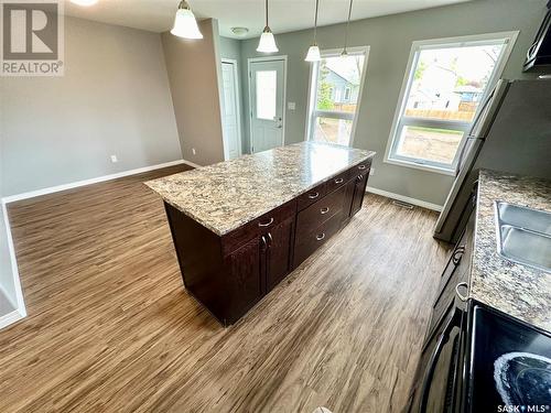 22 & 24 8Th Street Ne, Weyburn, SK - Indoor Photo Showing Kitchen With Fireplace