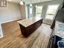 22 & 24 8Th Street Ne, Weyburn, SK  - Indoor Photo Showing Kitchen With Fireplace 