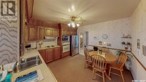 51 Daffodil Crescent, Regina, SK - Indoor Photo Showing Kitchen With Double Sink