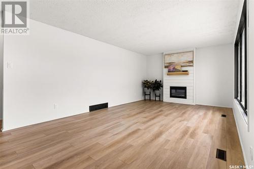 202 Maclean Street, Raymore, SK - Indoor Photo Showing Living Room With Fireplace