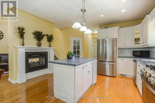 91 Mary Jane Road, Tiny, ON - Indoor Photo Showing Kitchen With Fireplace With Upgraded Kitchen