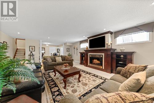 1366 Ontario Street, Hamilton Township, ON - Indoor Photo Showing Living Room With Fireplace