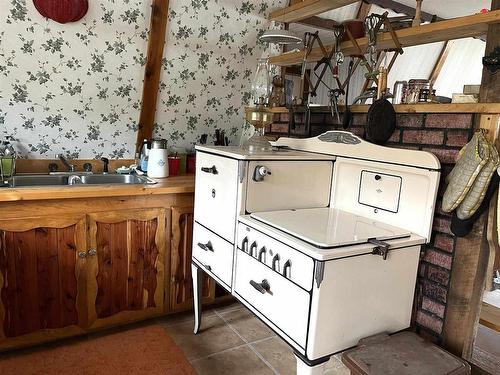 399 Oak Grove Road, Rainy River, ON - Indoor Photo Showing Kitchen With Double Sink