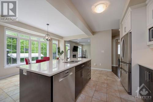 kitchen with custom island - 570 Pinawa Circle, Ottawa, ON - Indoor Photo Showing Kitchen With Double Sink