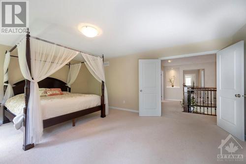 primary bedroom with double doors - 570 Pinawa Circle, Ottawa, ON - Indoor Photo Showing Bedroom