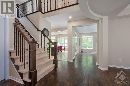 lower hall looking at custom staircase - 570 Pinawa Circle, Ottawa, ON - Indoor Photo Showing Other Room