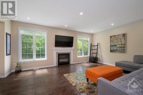 ground floor family room - 570 Pinawa Circle, Ottawa, ON - Indoor Photo Showing Living Room With Fireplace