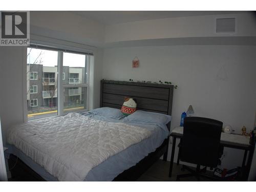 725 Academy Way Unit# 102, Kelowna, BC - Indoor Photo Showing Bedroom