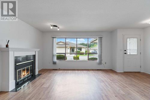 151 8Th Avenue Sw Unit# 18, Salmon Arm, BC - Indoor Photo Showing Living Room With Fireplace