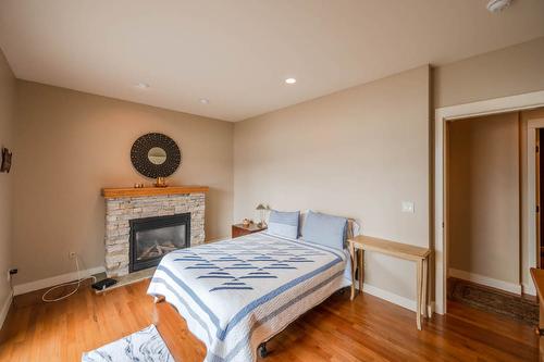 17019 Lakeshore Drive, Summerland, BC - Indoor Photo Showing Bedroom With Fireplace