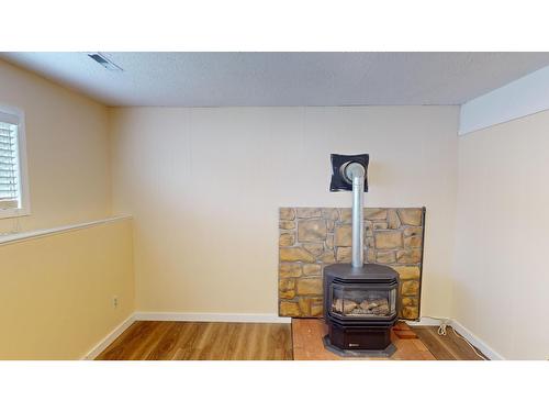 2617 2Nd Street S, Cranbrook, BC - Indoor Photo Showing Other Room With Fireplace