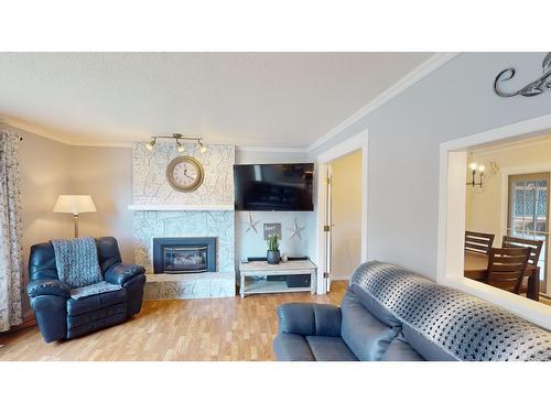 2617 2Nd Street S, Cranbrook, BC - Indoor Photo Showing Living Room With Fireplace