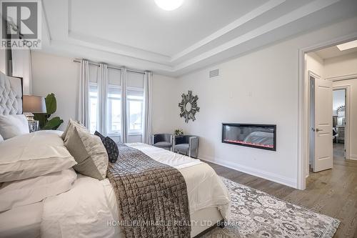 156 Wainfleet Crescent, Vaughan, ON - Indoor Photo Showing Bedroom With Fireplace