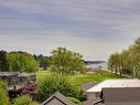 303-2589 Penrhyn St, Saanich, BC  - Outdoor With Body Of Water With View 