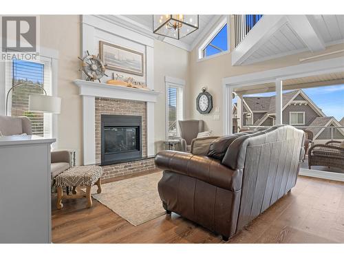 6747 Marbella Loop Unit# 304, Kelowna, BC - Indoor Photo Showing Living Room With Fireplace