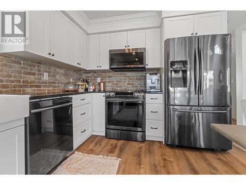 6747 Marbella Loop Unit# 304, Kelowna, BC - Indoor Photo Showing Kitchen With Upgraded Kitchen