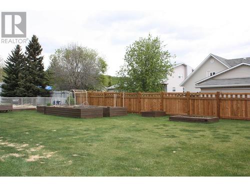 9707 N Spruce Street, Taylor, BC - Outdoor With Backyard