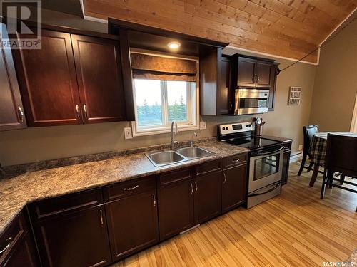 104 Sunridge Road, Pebble Baye, SK - Indoor Photo Showing Kitchen With Double Sink