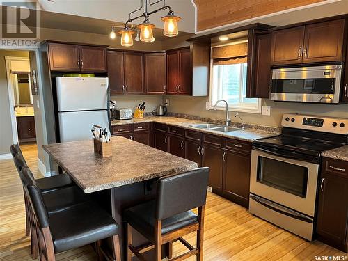 104 Sunridge Road, Pebble Baye, SK - Indoor Photo Showing Kitchen With Double Sink